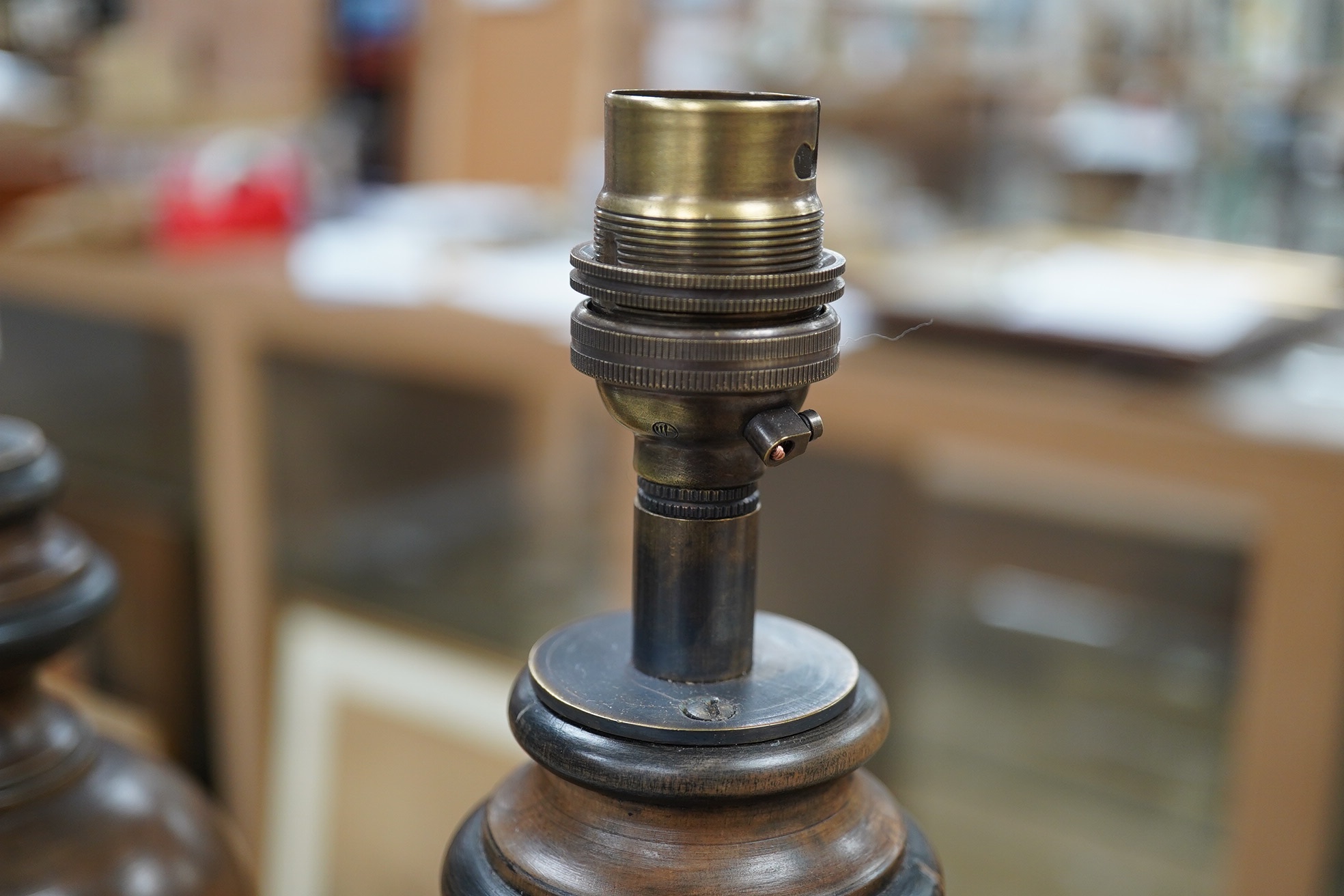 A pair of vintage English carved wood table lamps, wired, 54cm high to top of bulb holder, 55cm high. Condition - good